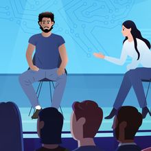 Illustration of four speakers on a panel facing an audience with a blue background behind them.