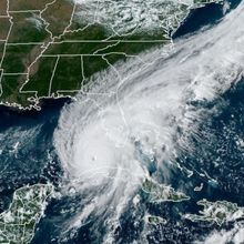 satellite view of Hurricane Ian in between Cuba and Florida&#39;s Gulf Coast