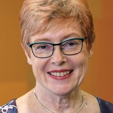 Caroline Gargett, a biologist at the Hudson Institute of Medical Research in Australia, studies endometrial stem cells. She has short hair, wears glasses, and smiles at the camera.